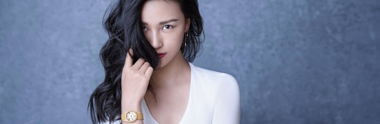 Chen Man matches rose gold diamond earrings with a luxury watch