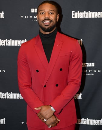 Michael B. Jordan wearing white gold diamond rings and Piaget luxury watch